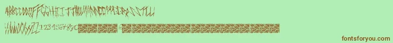 フォントFreakymanor – 緑の背景に茶色のフォント