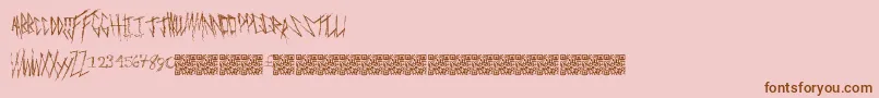 Freakymanor-Schriftart – Braune Schriften auf rosa Hintergrund