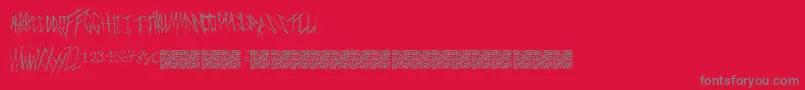 Freakymanor-fontti – harmaat kirjasimet punaisella taustalla