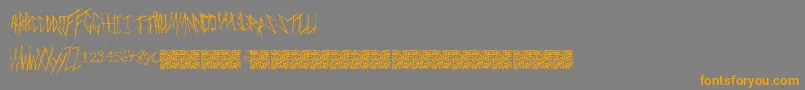 Czcionka Freakymanor – pomarańczowe czcionki na szarym tle