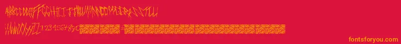 Freakymanor-Schriftart – Orangefarbene Schriften auf rotem Hintergrund