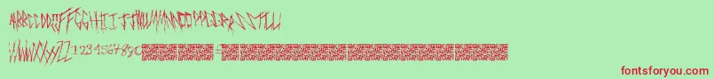 Freakymanor-Schriftart – Rote Schriften auf grünem Hintergrund