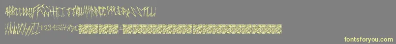 フォントFreakymanor – 黄色のフォント、灰色の背景