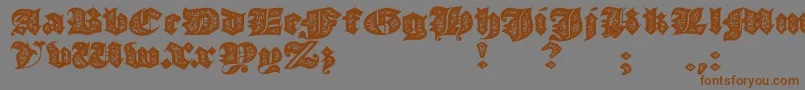 JmhMorenetaDivineOld-Schriftart – Braune Schriften auf grauem Hintergrund