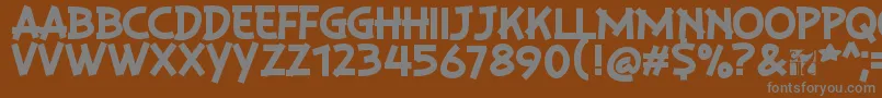 PlaysirRegular-fontti – harmaat kirjasimet ruskealla taustalla