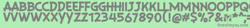 PlaysirRegular-fontti – harmaat kirjasimet vihreällä taustalla