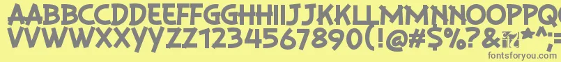 PlaysirRegular-fontti – harmaat kirjasimet keltaisella taustalla
