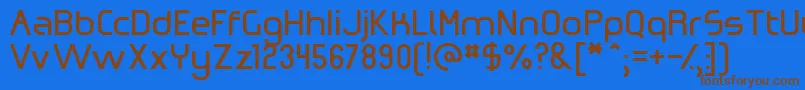 フォントOmicronZeta – 茶色の文字が青い背景にあります。