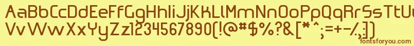 フォントOmicronZeta – 茶色の文字が黄色の背景にあります。