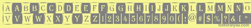 AAlgeriuscmdc1cmb-fontti – harmaat kirjasimet keltaisella taustalla