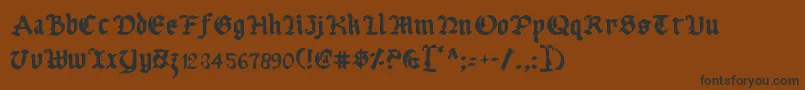 フォントUberv2 – 黒い文字が茶色の背景にあります