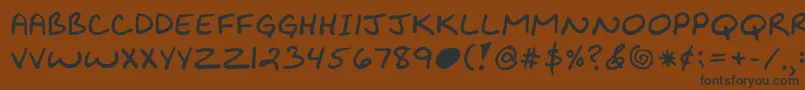 Kibbyboldfont-Schriftart – Schwarze Schriften auf braunem Hintergrund
