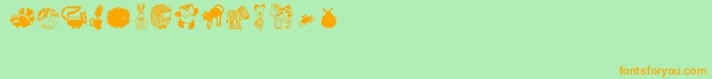 Czcionka Critters1 – pomarańczowe czcionki na zielonym tle