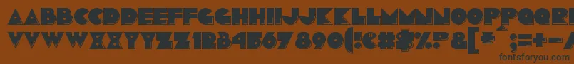 Pacmania Font – Black Fonts on Brown Background