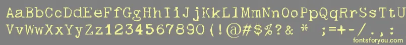 Fonte Skulltypewr00 – fontes amarelas em um fundo cinza