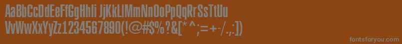 ARubricaxtcn-fontti – harmaat kirjasimet ruskealla taustalla