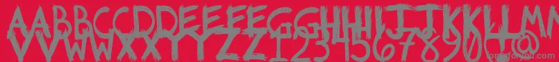 Riotfont1-Schriftart – Graue Schriften auf rotem Hintergrund