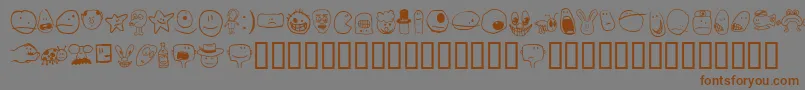 フォントTombatsSmilies – 茶色の文字が灰色の背景にあります。