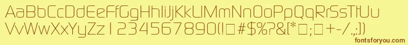 フォントBazoukLightSsiLight – 茶色の文字が黄色の背景にあります。