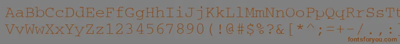 フォントCouriertm – 茶色の文字が灰色の背景にあります。