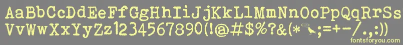 Шрифт BohemianTypewriter – жёлтые шрифты на сером фоне