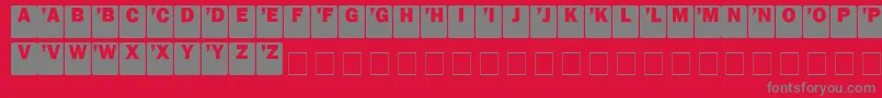 DropcapsSans-Schriftart – Graue Schriften auf rotem Hintergrund