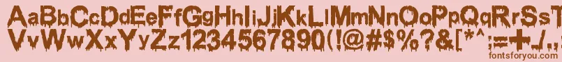 Шрифт WoodcutterDrippingClassicFont – коричневые шрифты на розовом фоне