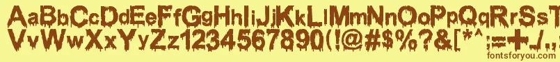 Шрифт WoodcutterDrippingClassicFont – коричневые шрифты на жёлтом фоне