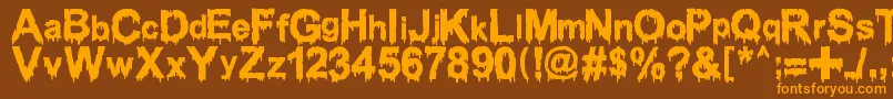 Шрифт WoodcutterDrippingClassicFont – оранжевые шрифты на коричневом фоне