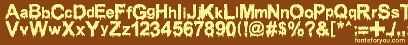 Шрифт WoodcutterDrippingClassicFont – жёлтые шрифты на коричневом фоне