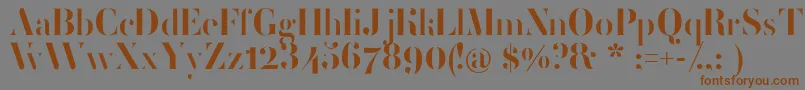 フォントFemoralisRegular – 茶色の文字が灰色の背景にあります。