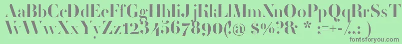 FemoralisRegular-fontti – harmaat kirjasimet vihreällä taustalla