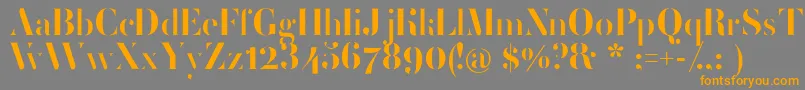 フォントFemoralisRegular – オレンジの文字は灰色の背景にあります。