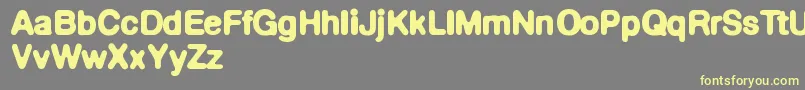 Defontedemigras Font – Yellow Fonts on Gray Background