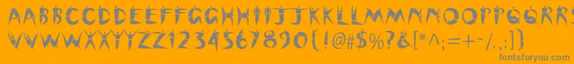 Cutoutstd-Schriftart – Graue Schriften auf orangefarbenem Hintergrund