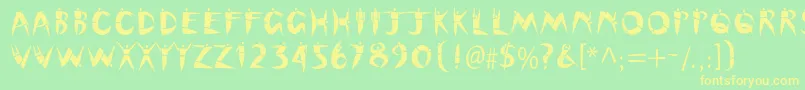 Cutoutstd Font – Yellow Fonts on Green Background