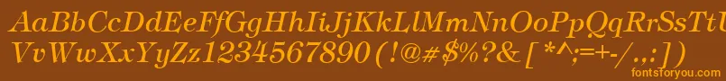 フォントTimberItalic – オレンジ色の文字が茶色の背景にあります。