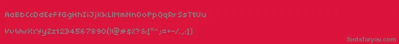 フォントTinyunicode – 赤い背景に灰色の文字