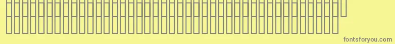 Uzgidrografia-Schriftart – Graue Schriften auf gelbem Hintergrund