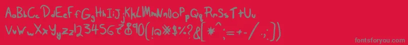 フォントTairak.Smessynezz – 赤い背景に灰色の文字