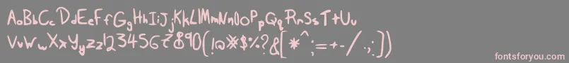 Tairak.Smessynezz-Schriftart – Rosa Schriften auf grauem Hintergrund