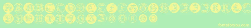 Ornamentalinitialbuttons-Schriftart – Gelbe Schriften auf grünem Hintergrund