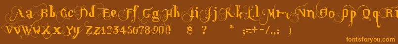 フォントOpusPix – オレンジ色の文字が茶色の背景にあります。