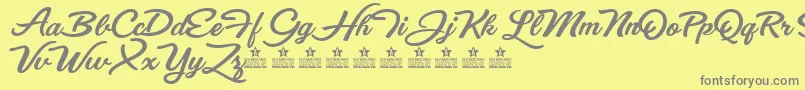 EyesWideOpenPersonalUse-fontti – harmaat kirjasimet keltaisella taustalla