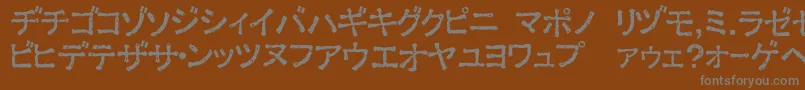 フォントExKataDamaged – 茶色の背景に灰色の文字