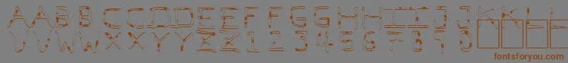 フォントPfVeryverybadfont7Liquid – 茶色の文字が灰色の背景にあります。