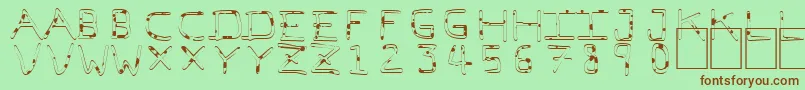 フォントPfVeryverybadfont7Liquid – 緑の背景に茶色のフォント
