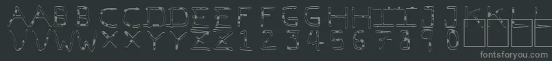 PfVeryverybadfont7Liquid-fontti – harmaat kirjasimet mustalla taustalla