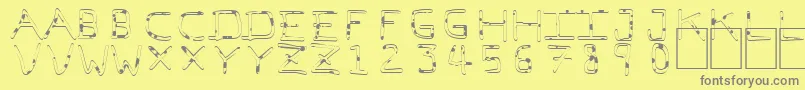 PfVeryverybadfont7Liquid-fontti – harmaat kirjasimet keltaisella taustalla