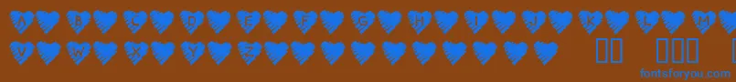 Fonte KrScribbleHeart – fontes azuis em um fundo marrom